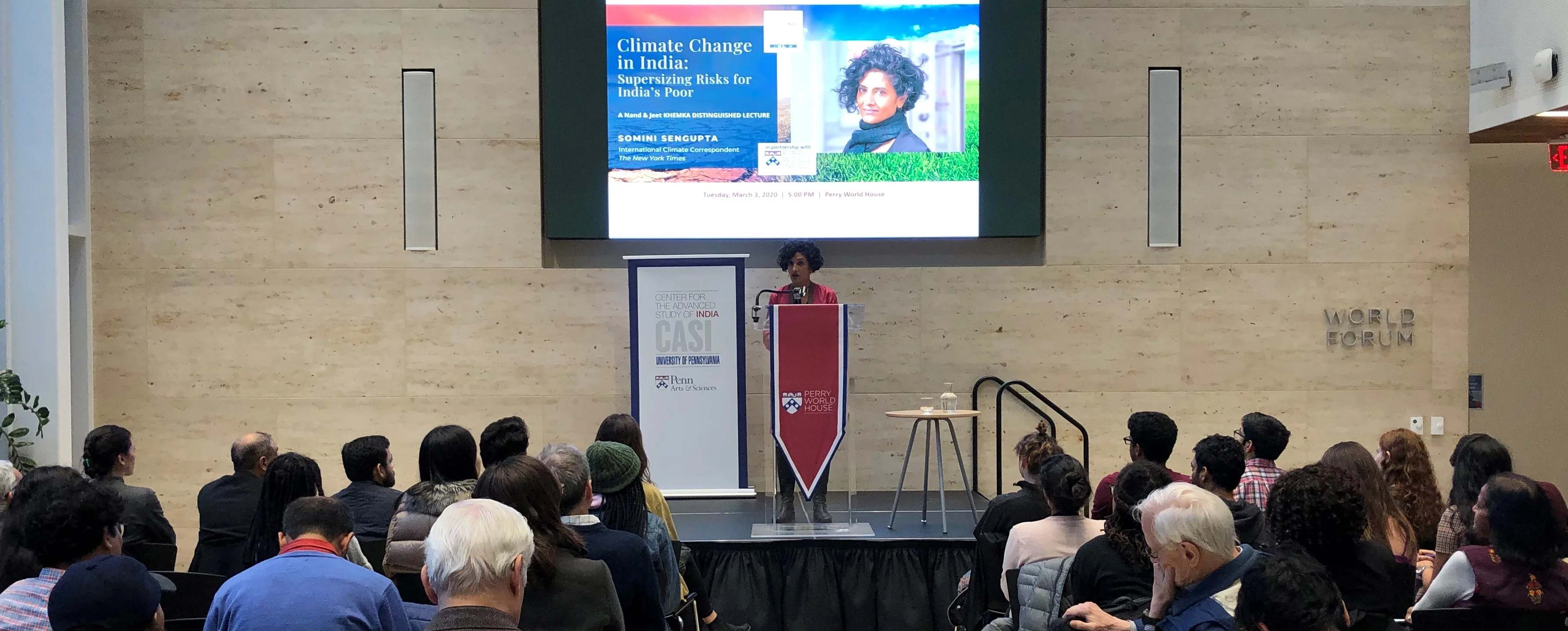 Lecture speaker at podium with audience