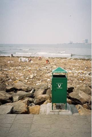 green trash can in foreground
