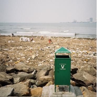 green trash can in foreground